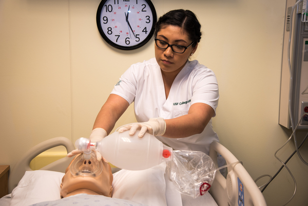 Nursing student working with patient simulation