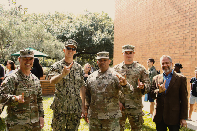 Military giving the Bulls "Horns Up" sign