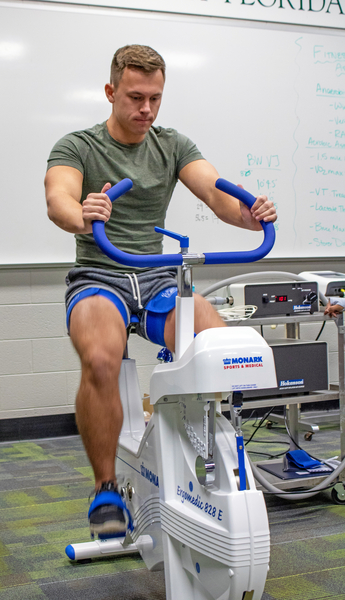 Student on exercise bike