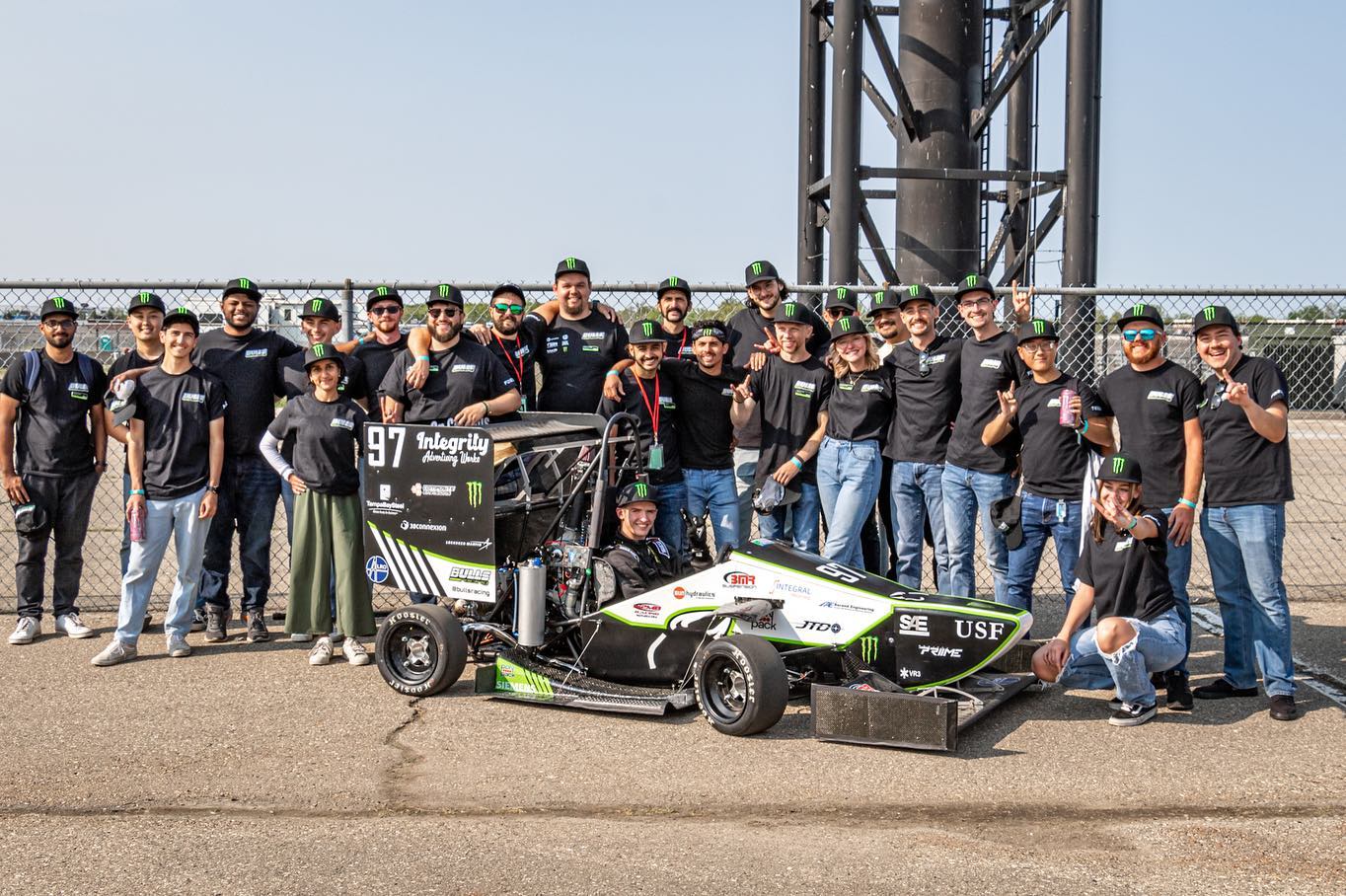 USF racing team posing with racecar