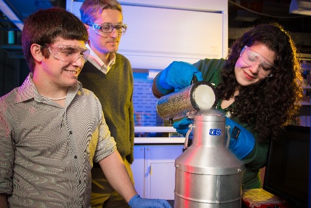 Students in a lab wearing safety glasses pouring liquid nitrogen